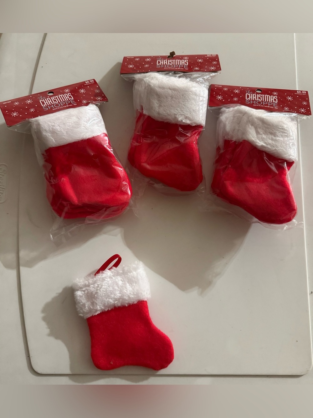 Set of 19 mini Christmas stockings. Red and white. 5 x 3.5 inches